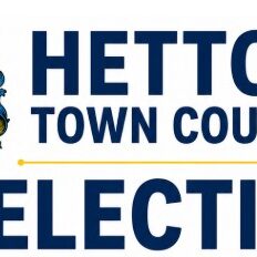 Hetton Town Council Election logo with a blue and gold crest showing the word PROGRESS.