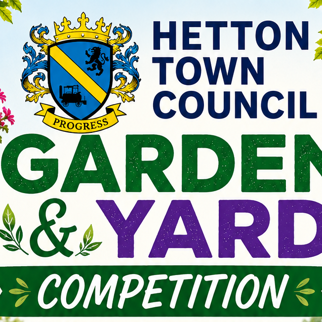 Hetton Town Council Garden & Yard Competition sign with flowers, crest, and leafy background.